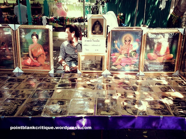 This vendor sells holy pictures and other items for prayers